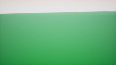 Yeşil uçaktan yükselen yeşil 3D modelli şehrin geniş bir görüntüsü.