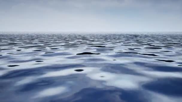 Sebuah animasi air laut di bawah langit biru siang hari — Stok Video
