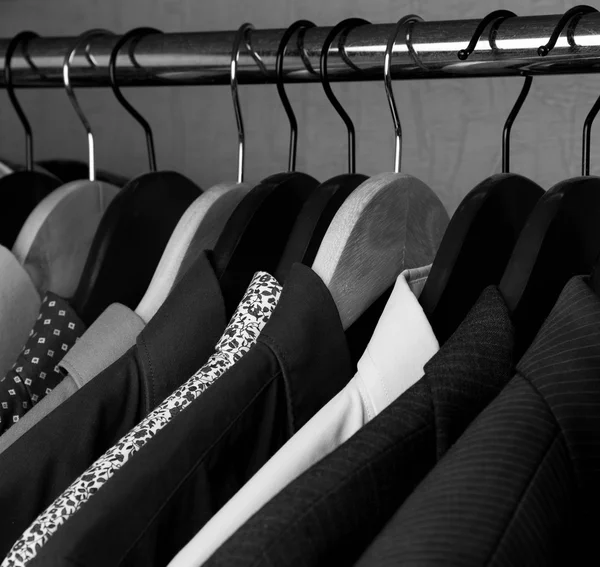 Shirts and jackets in wardrobe isolated closeup — Stock Photo, Image