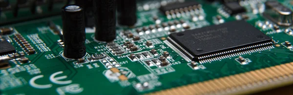 Computer circuit Board close up isolated on wooden table — Stock Photo, Image