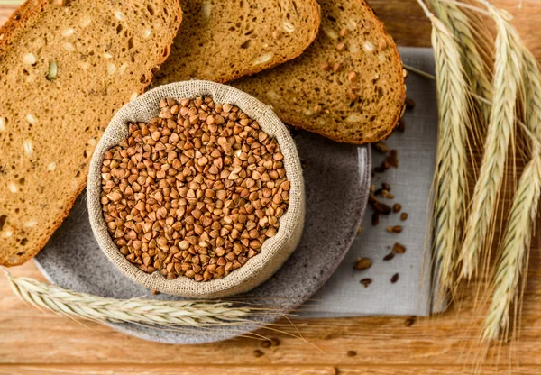 buckwheat in a linen bag in background grain bread