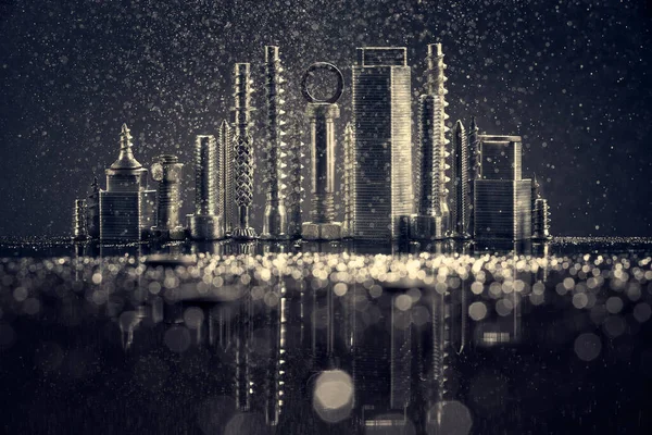 Abstract panorama of city illuminated by bright light with reflection, made by metal bolt and nut chrome. Black background with bokeh. Stock Image