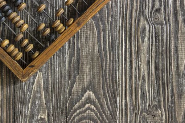 Abakus auf einem Holztisch liegend. Hintergrund von oben — Stockfoto