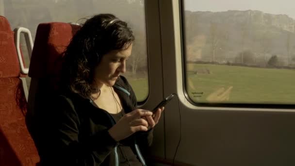 Girl reading ebook in the train — Stock Video