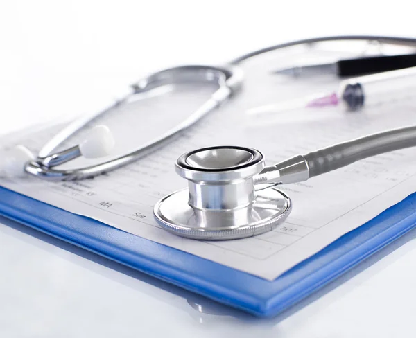 Stethoscope with blue medical clipboard — Stock Photo, Image