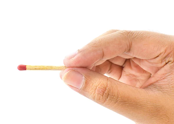 Hand holding a fired matchstick on a white background Stock Photo