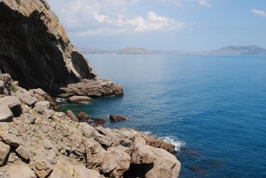 massive cliffs surrounded by the sea
