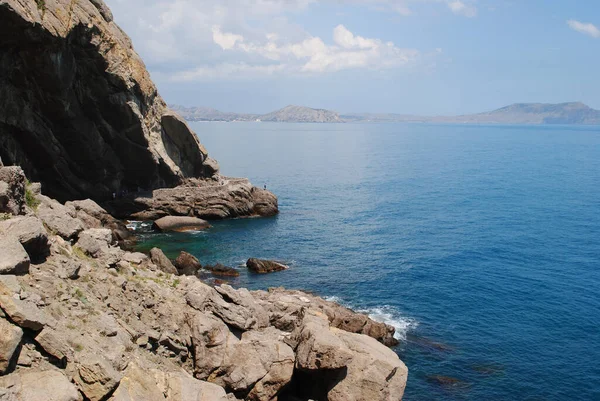 massive cliffs surrounded by the sea