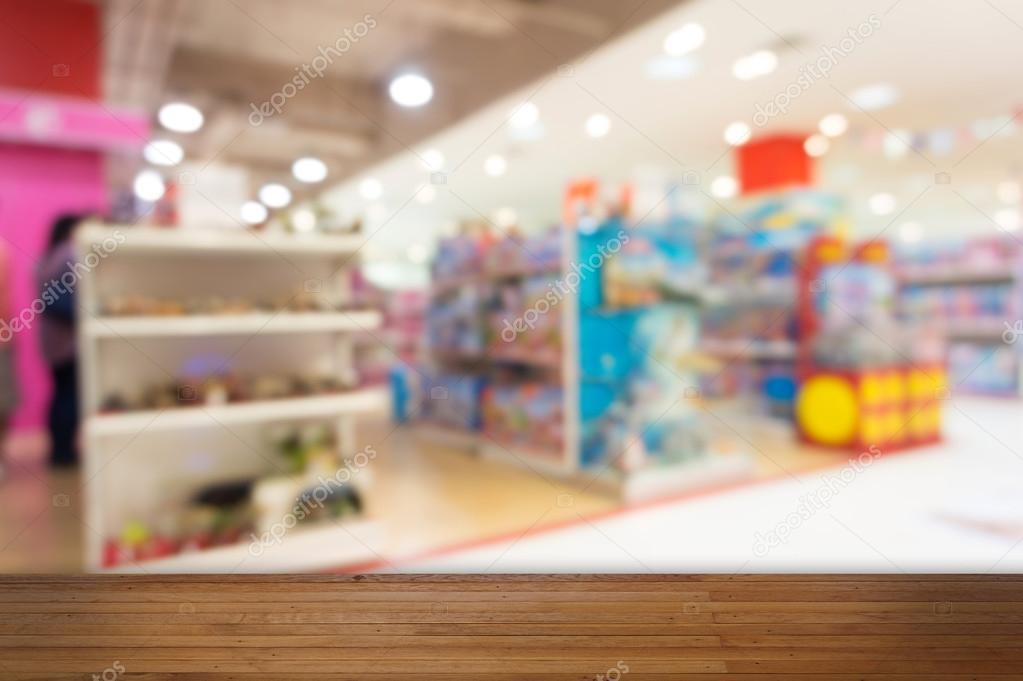 Wooden floor with Toy Department blurred background