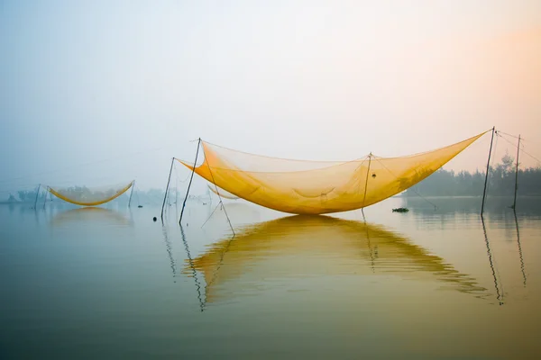 Unidentified fisher man check his nets — Stock Photo, Image