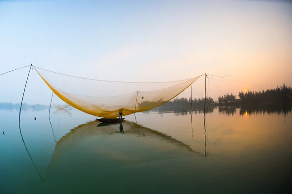 Unidentified fisher man check his nets — Stock Photo, Image