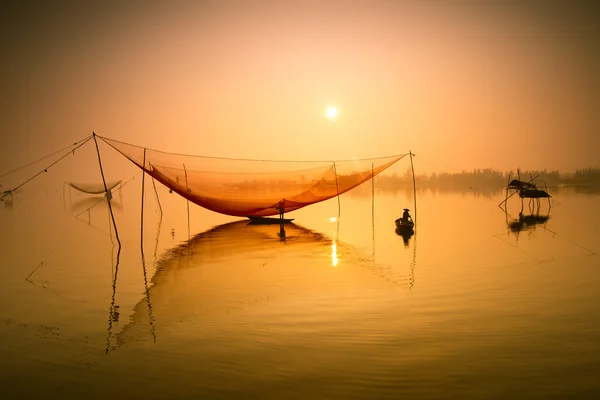 Unidentified fisher man check his nets — Stock Photo, Image