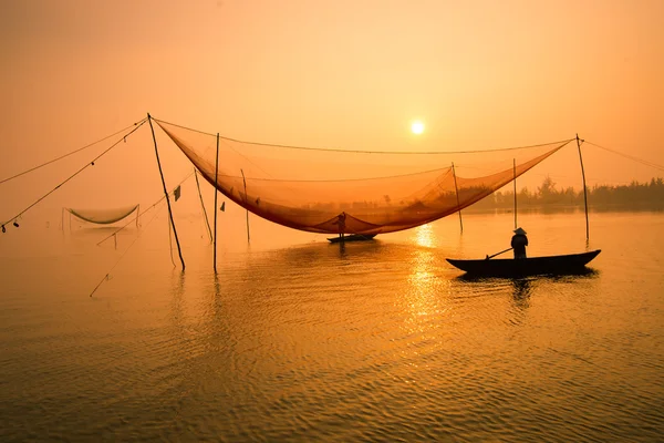 Unidentified fisher man check his nets — Stock Photo, Image