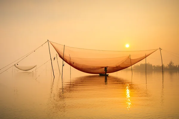 Unidentified fisher man check his nets — Stock Photo, Image