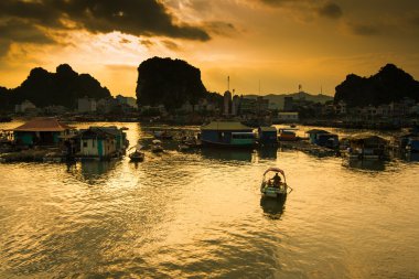 Floating village in Halong bay clipart