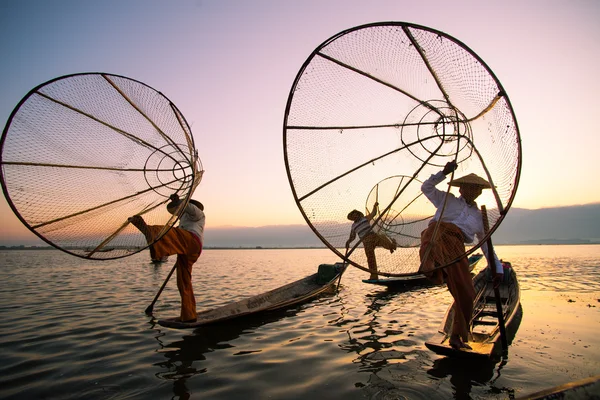 Three fishermen catches fish — Stock Photo, Image