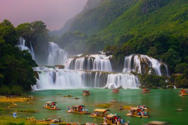 Tourist visit Ban Gioc waterfall clipart