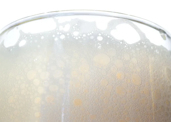Espuma de cerveja em um copo — Fotografia de Stock