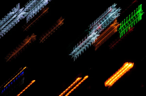 Luzes coloridas de estrelas de borrão de Natal — Fotografia de Stock