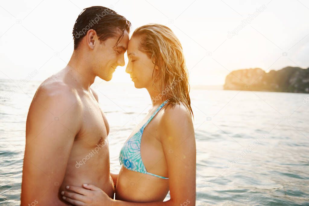 Shot of an affectionate couple spending the day at the beach