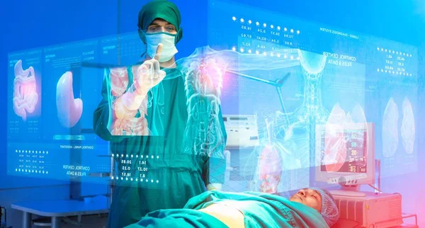 doctor using hologram technology over patient in operating room