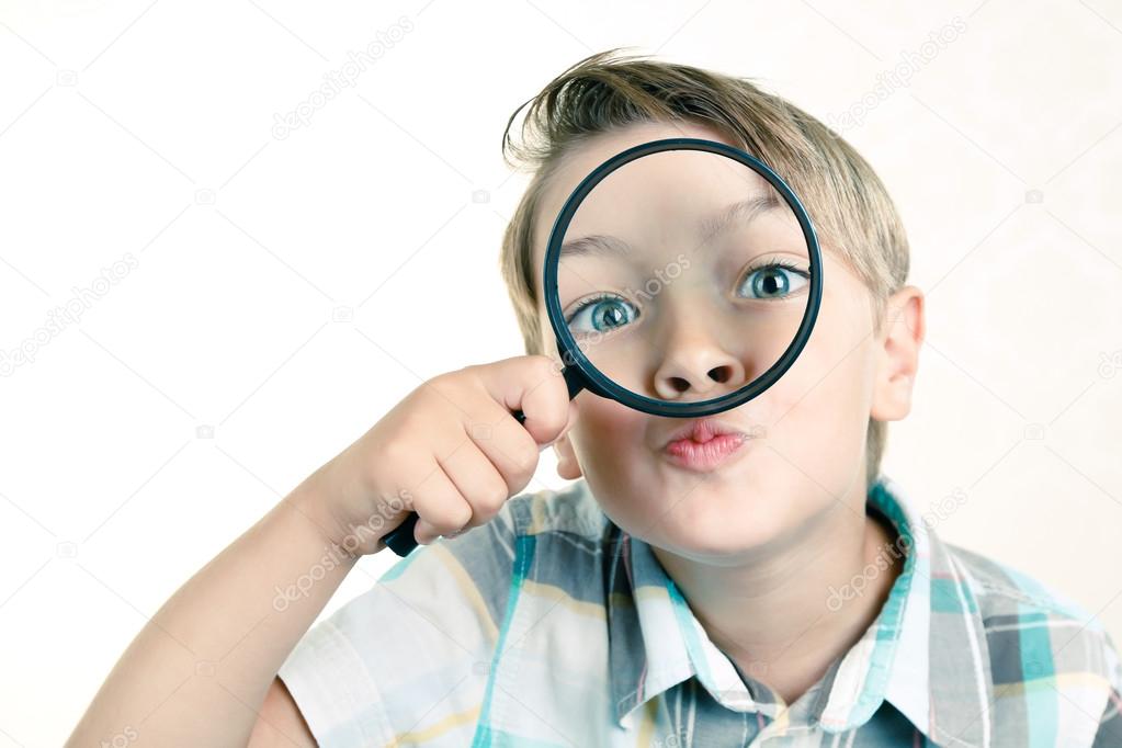 Boy with a magnifier