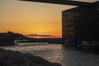 Beautiful sunset near the fort and museum on the Mediterranean coast near the harbor of Marseille, France