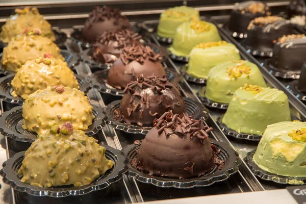 display of delicious creme and chocolate deserts