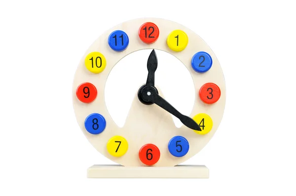 Wooden clock on a white background. Toy for Children Royalty Free Stock Images
