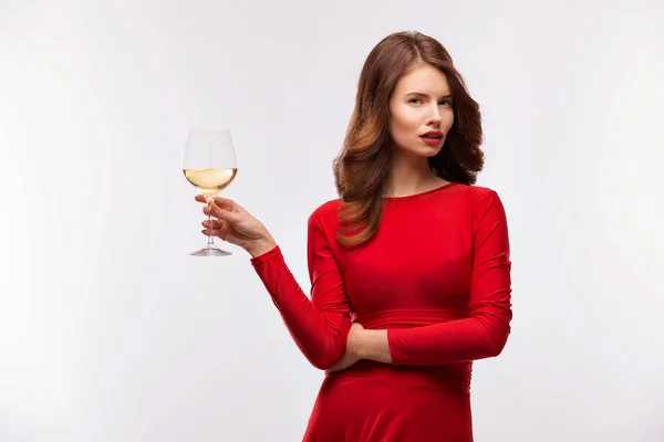 Woman in red gown with champagne glass on white — Stock Photo, Image