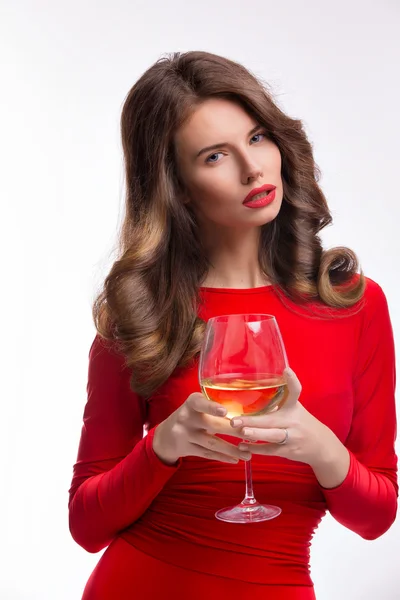Woman in red gown with champagne glass on white — Stock Photo, Image