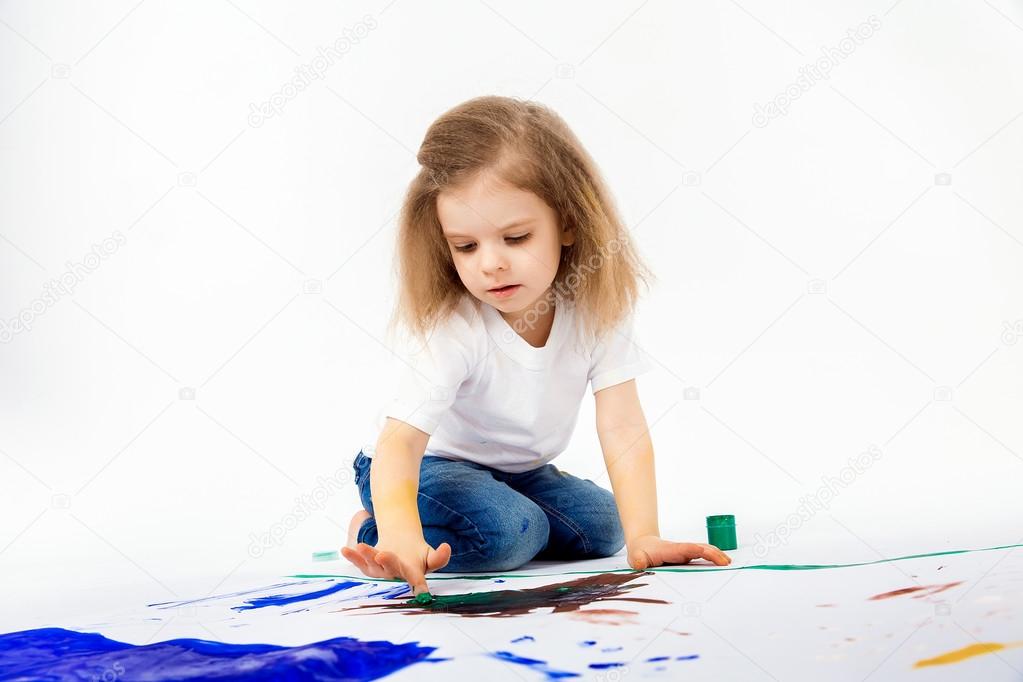 Adorable little girl, modern hair style, white shirt, blue jeans is drawing pictures by her hands with paints. Isolate. Stock Photo by ©zamuruev 105253188 Adorable little girl, modern hair style, white shirt, blue jeans is drawing pictures by her hands with paints. Isolate. Stock Photo by ©zamuruev 105253188