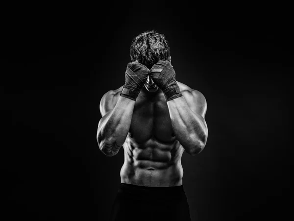 Strong muscular fighter hiding face from camera — Stock Photo, Image