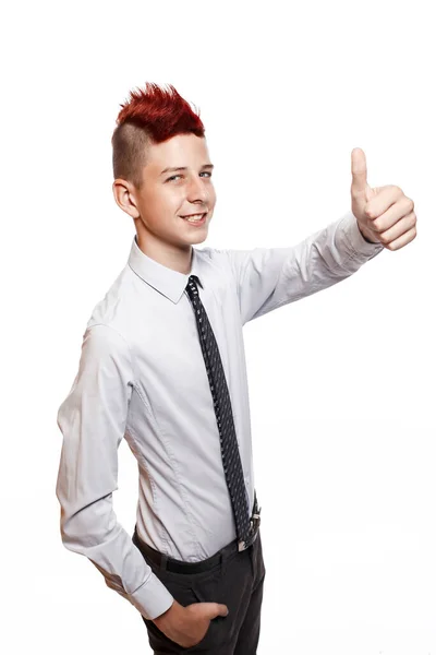 A smiling teenager shows his thumb up isolated on the white background — Stock Photo, Image