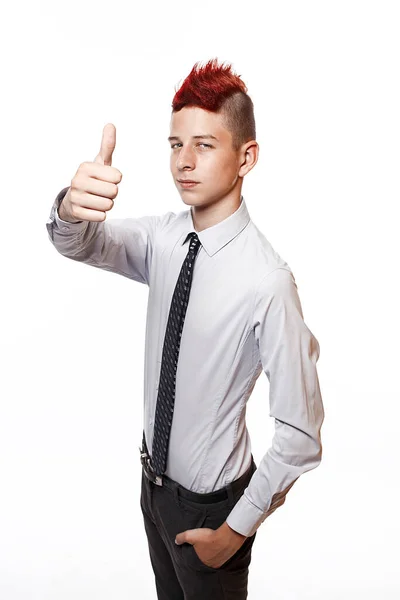 A smiling teenager shows his thumb up isolated on the white background — Stock Photo, Image