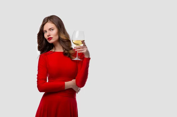 Beautiful woman holding glass of wine onwhite background — Stock Photo, Image