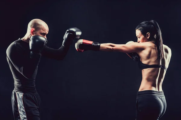 Shirtless Woman exercising with trainer at boxing and self defen — Stock Photo, Image