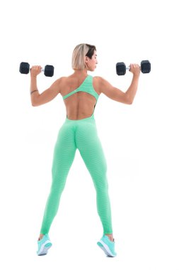 Dambılı güçlü bir kadın. Spor giyim kuşamında spor kadın fotoğrafı.
