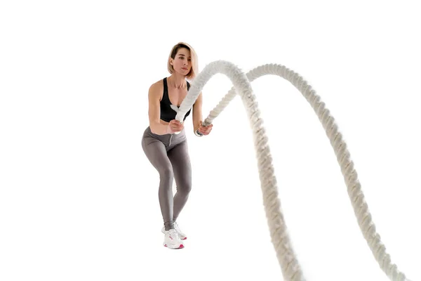 Woman doing exercises with battle rope. — Stock Photo, Image