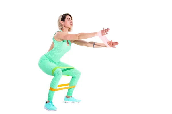Vrouw die fitness weerstandsbanden traint in studio silhouet i — Stockfoto