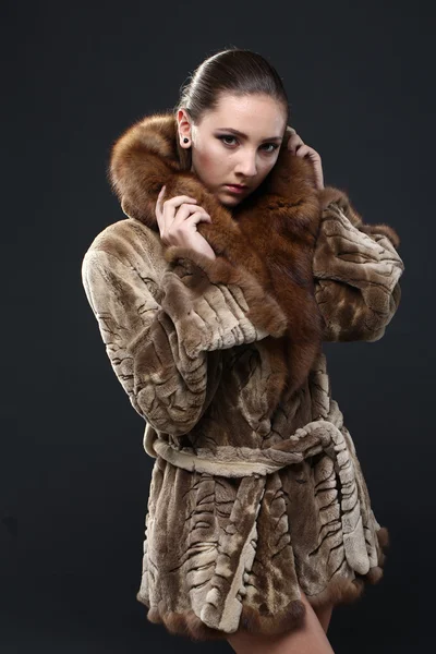 Portrait of a seductive lady in fur coat