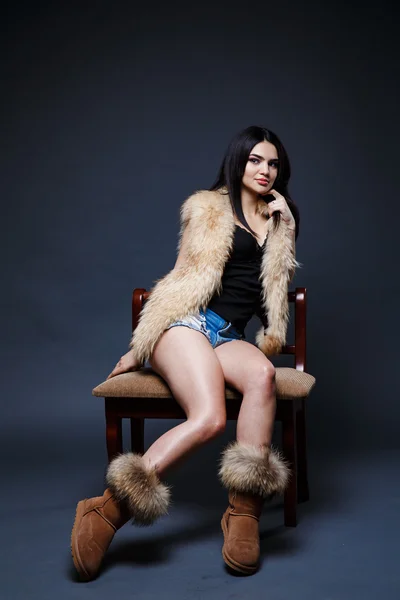 Portrait of a seductive lady in fur coat