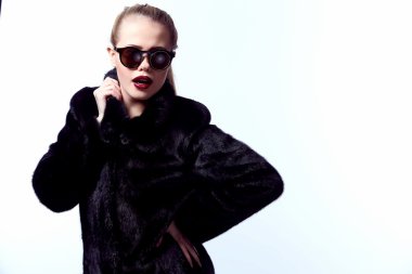 Fashion woman Beauty girl model blonde long hair and bright makeup, sexy blond vogue style female, beauty and jewelry model vogue style, young woman in luxury fur coat, studio isolated.