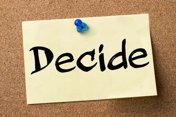 Decide - adhesive label pinned on bulletin board — Stock Photo, Image