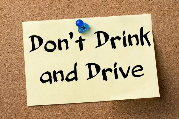 Don't Drink and Drive - adhesive label pinned on bulletin boar — Stock Photo, Image
