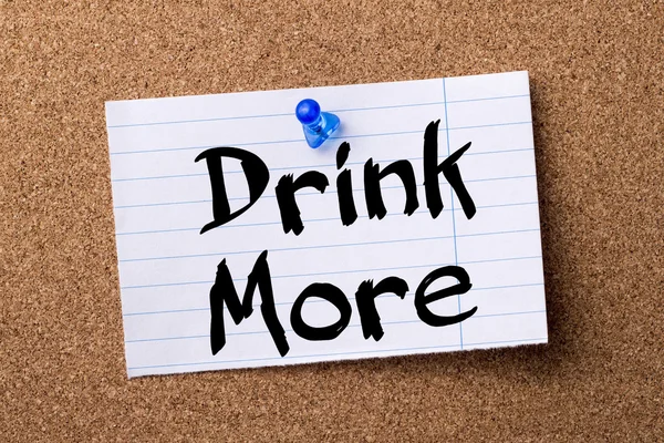 Drink More - teared note paper pinned on bulletin board