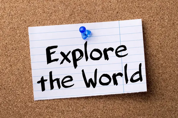 Explore the World - teared note paper pinned on bulletin board — Stock Photo, Image