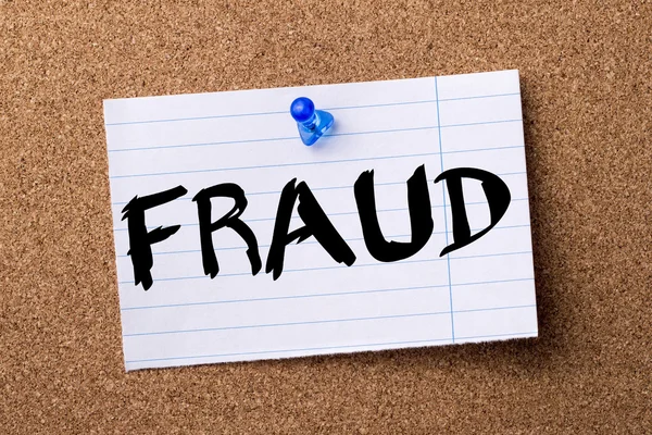 FRAUD - teared note paper pinned on bulletin board — Stock Photo, Image
