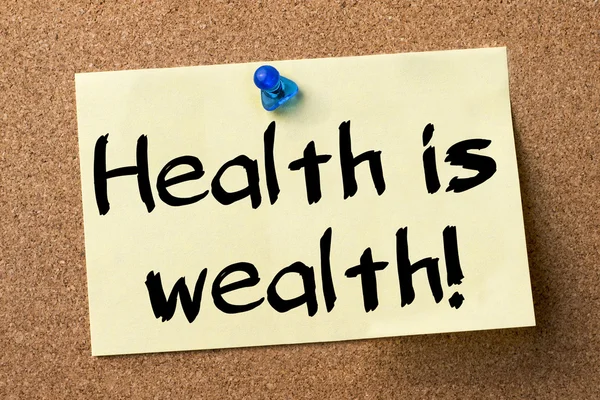 Zenginlik sağlıktır! -Yapışkanlı etiket tutturulmuş bulletin board — Stok fotoğraf