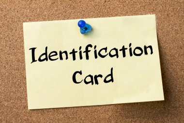 Kimlik kartı - yapışkanlı etiket bulletin board tutturulmuş.
